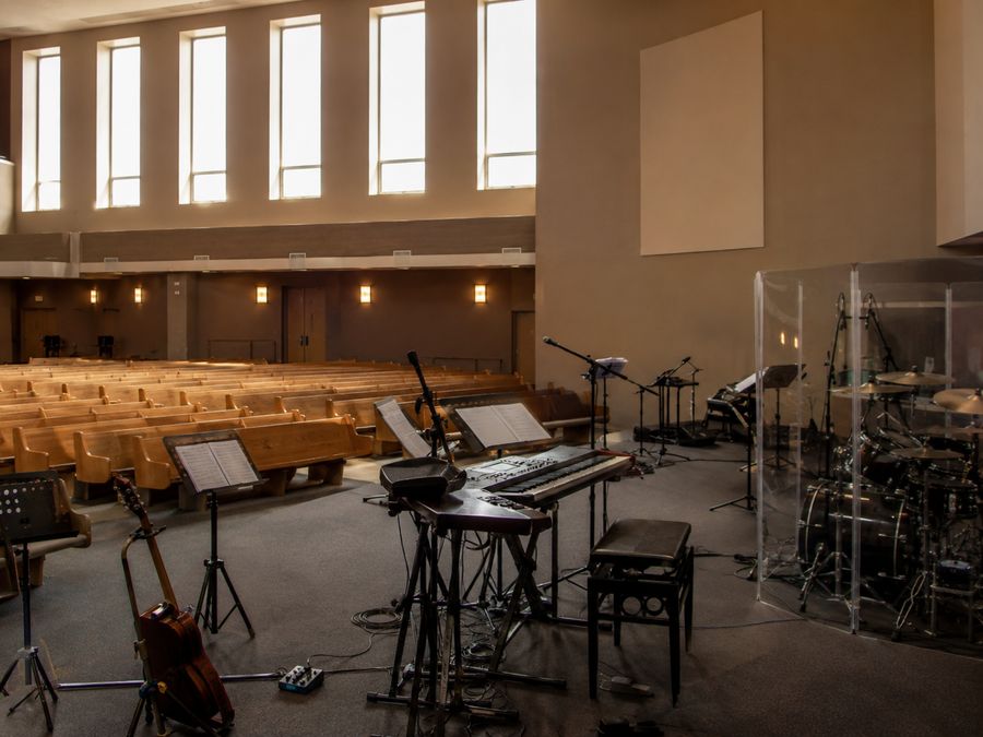 A church platform set for a full band on a weekday