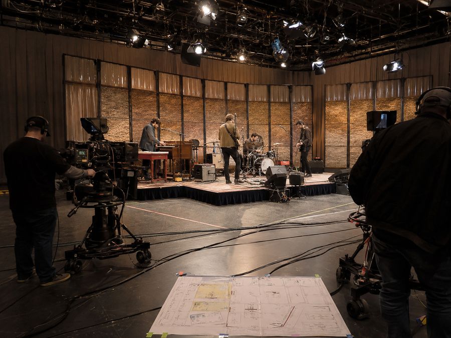 Television studio with cameras blocking a band riser